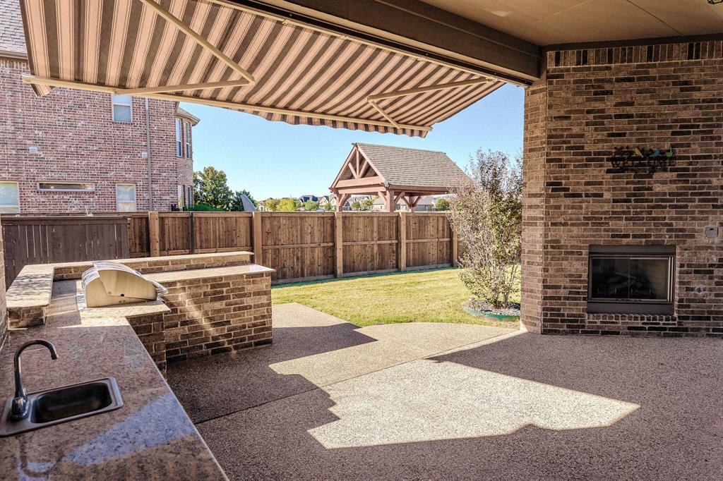2207 Galloway Boulevard Trophy Club, TX 76262 - Photo 34 of 36 a view of a porch with furniture and floor to ceiling window