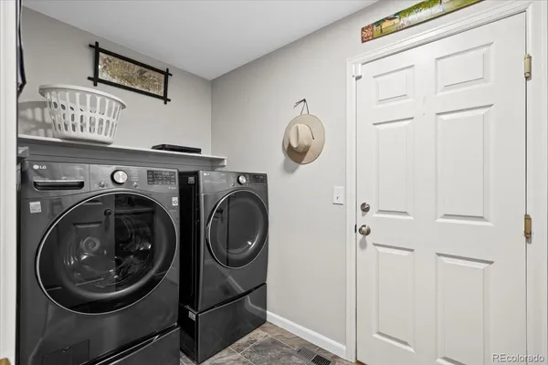 a view of a storage & utility room with washer and dryer