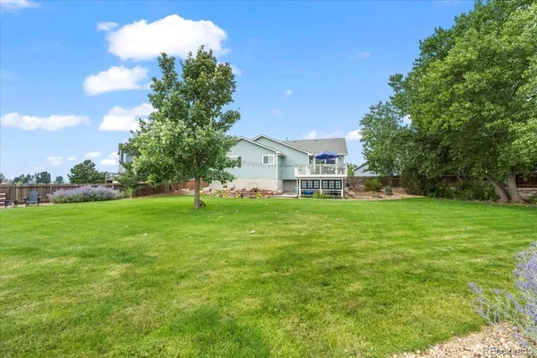 a view of house with garden space and trees