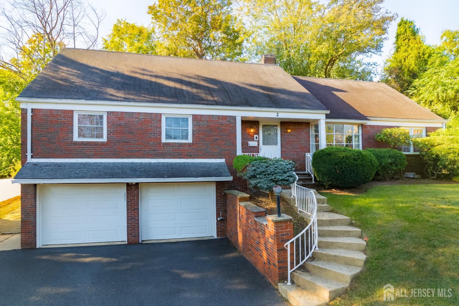 2 South Audlen Terrace Springfield, NJ 07081 - Photo 2 of 36 a front view of a house with yard