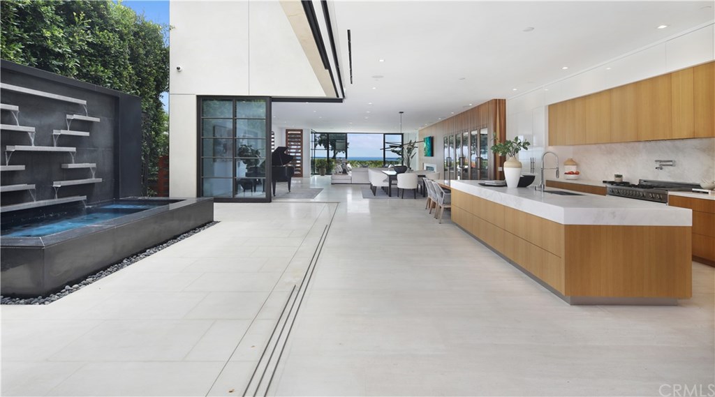 2914 Ocean Boulevard Corona del Mar, CA 92625 - Photo 12 of 60 a large kitchen with sink a stove and furniture