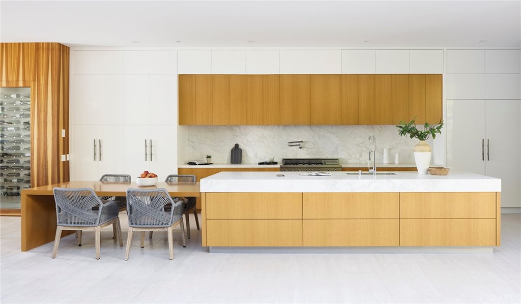 2914 Ocean Boulevard Corona del Mar, CA 92625 - Photo 13 of 60 a kitchen with a sink and cabinets