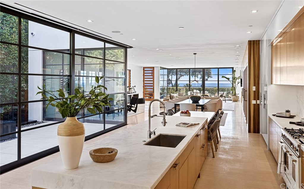 2914 Ocean Boulevard Corona del Mar, CA 92625 - Photo 14 of 60 a kitchen with a table and chairs