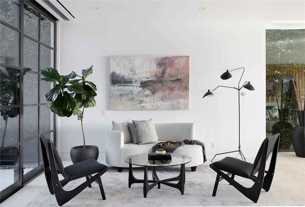 2914 Ocean Boulevard Corona del Mar, CA 92625 - Photo 20 of 60 a living room with furniture and a potted plant