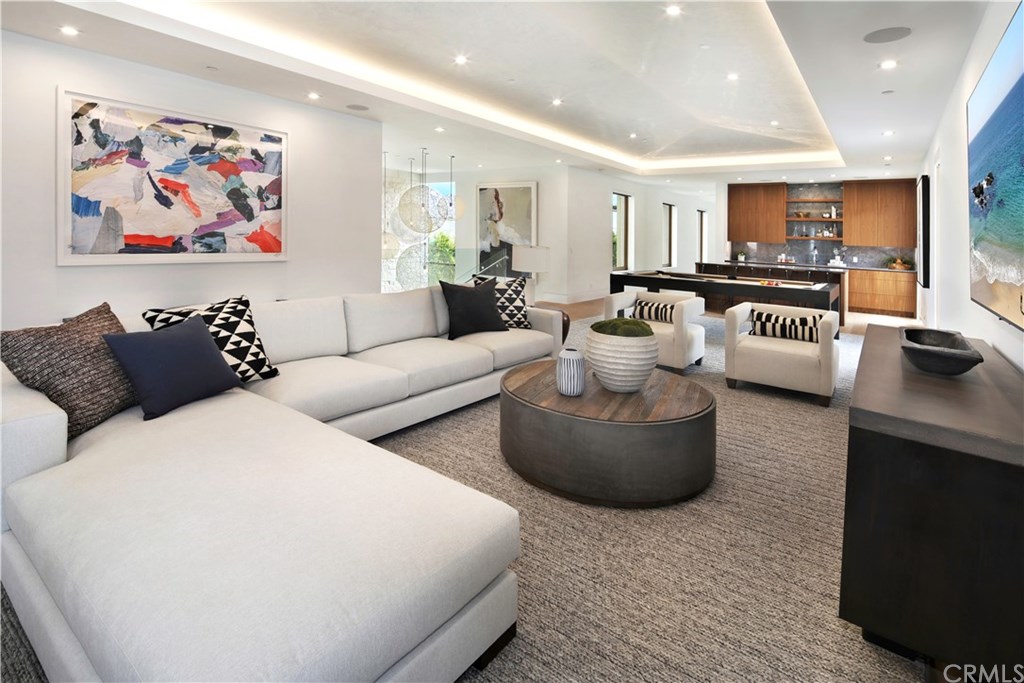 2914 Ocean Boulevard Corona del Mar, CA 92625 - Photo 26 of 60 a living room with furniture and a flat screen tv