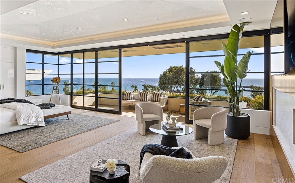 2914 Ocean Boulevard Corona del Mar, CA 92625 - Photo 30 of 60 a living room with furniture and a floor to ceiling window