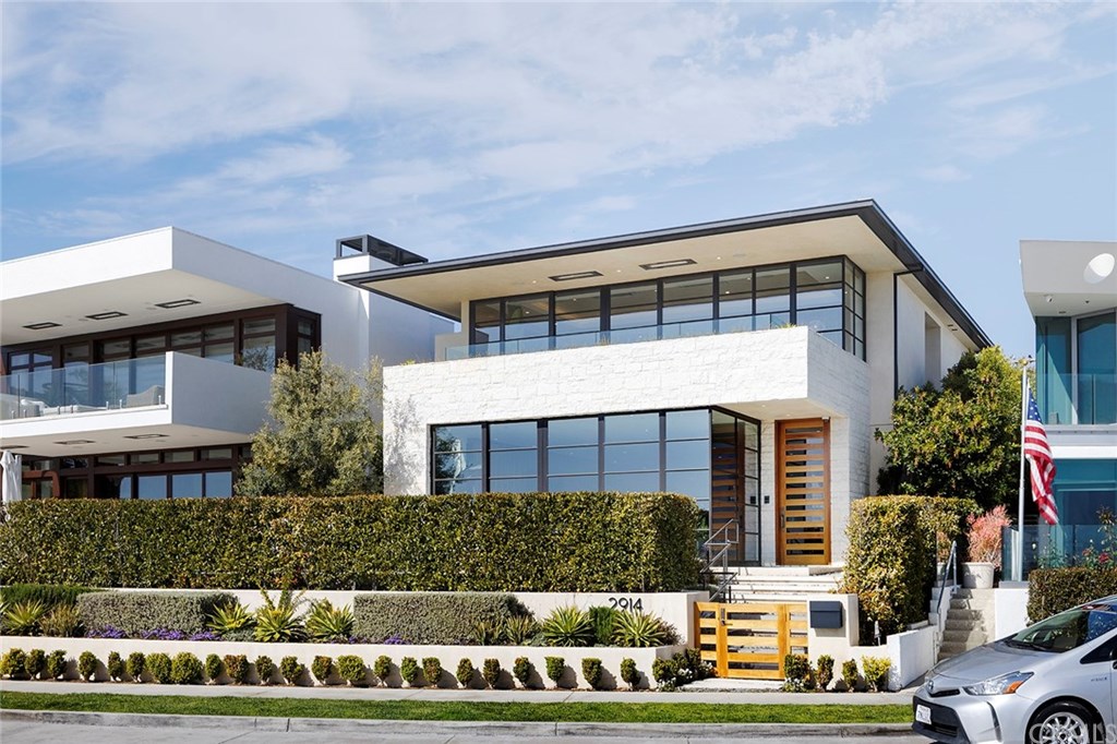 2914 Ocean Boulevard Corona del Mar, CA 92625 - Photo 3 of 60 a front view of a house with a yard
