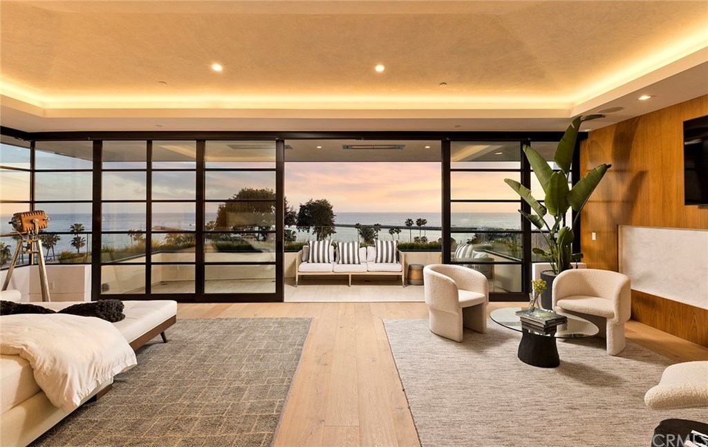 2914 Ocean Boulevard Corona del Mar, CA 92625 - Photo 31 of 60 a living room with furniture and a floor to ceiling window