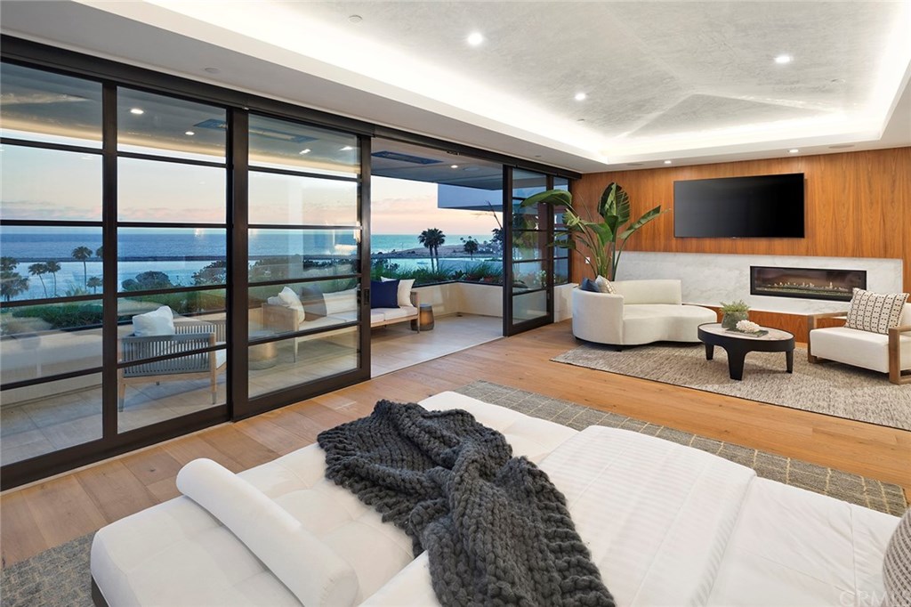 2914 Ocean Boulevard Corona del Mar, CA 92625 - Photo 32 of 60 a living room with furniture and a flat screen tv