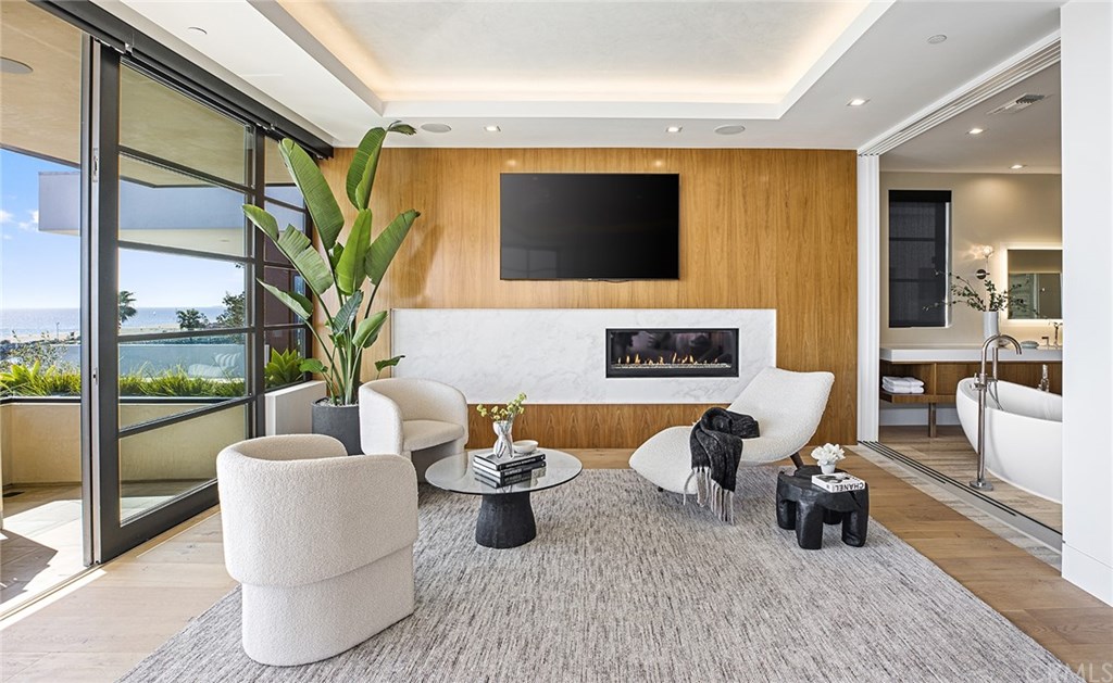 2914 Ocean Boulevard Corona del Mar, CA 92625 - Photo 34 of 60 a living room with furniture potted plant and a flat screen tv