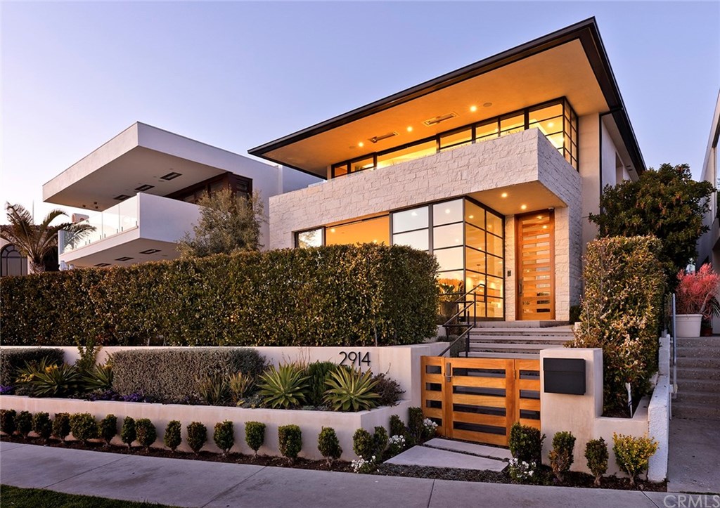 2914 Ocean Boulevard Corona del Mar, CA 92625 - Photo 4 of 60 a front view of a house with a yard