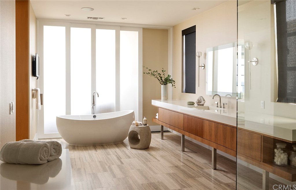 2914 Ocean Boulevard Corona del Mar, CA 92625 - Photo 43 of 60 a spacious bathroom with a double vanity sink and a large mirror