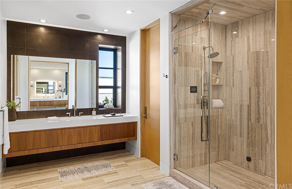 2914 Ocean Boulevard Corona del Mar, CA 92625 - Photo 46 of 60 a bathroom with a tub shower and sink