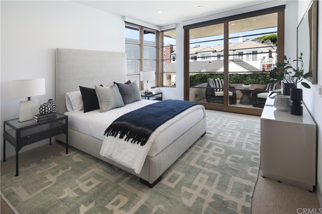 2914 Ocean Boulevard Corona del Mar, CA 92625 - Photo 48 of 60 a spacious bedroom with a bed and a large window