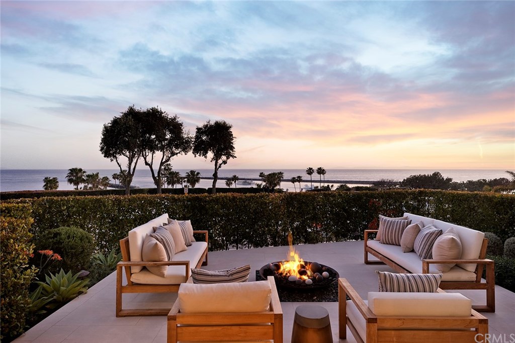 2914 Ocean Boulevard Corona del Mar, CA 92625 - Photo 5 of 60 a view of a roof deck with couches under an umbrella