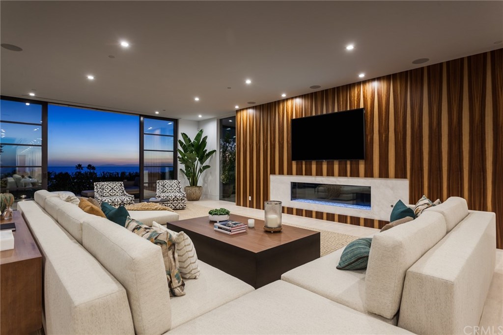2914 Ocean Boulevard Corona del Mar, CA 92625 - Photo 7 of 60 a living room with furniture and a flat screen tv