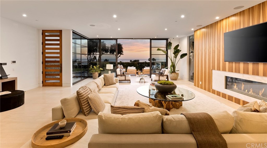 2914 Ocean Boulevard Corona del Mar, CA 92625 - Photo 8 of 60 a living room with furniture and a flat screen tv