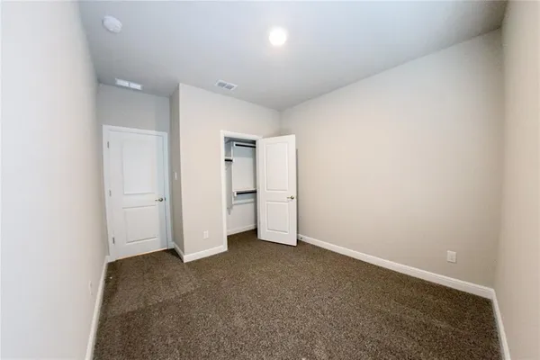 an empty room with a bathroom