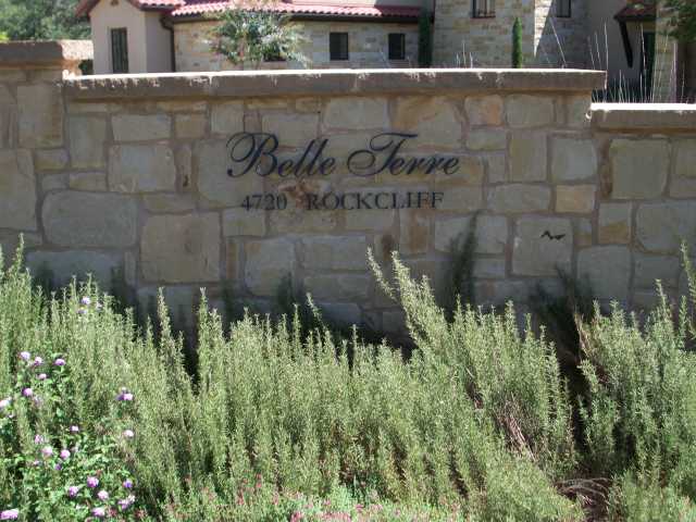 a partial view of a house with a yard