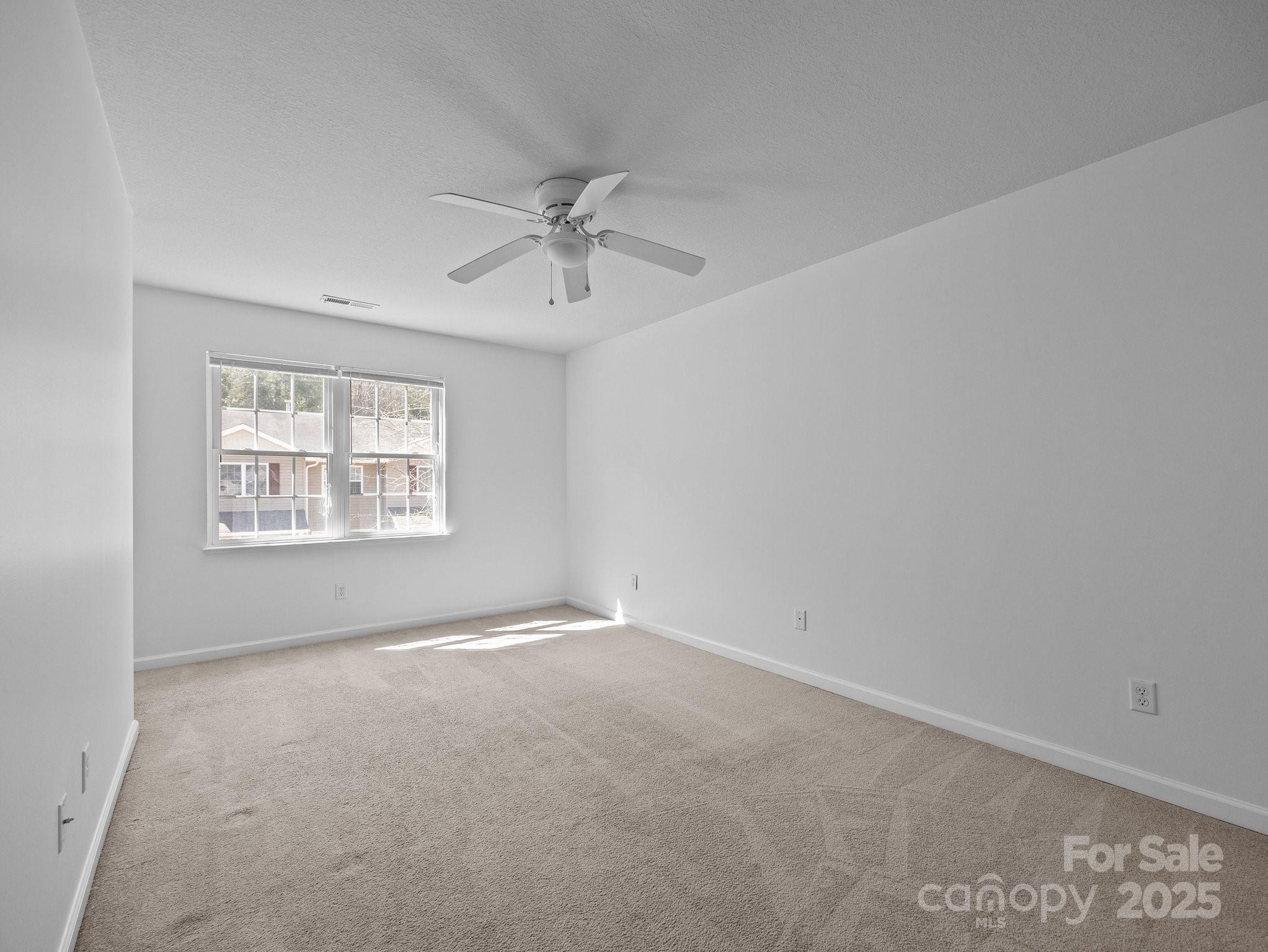 107 Alpine Ridge Drive Asheville, NC 28803 - Photo 18 of 29 a view of an empty room with a window