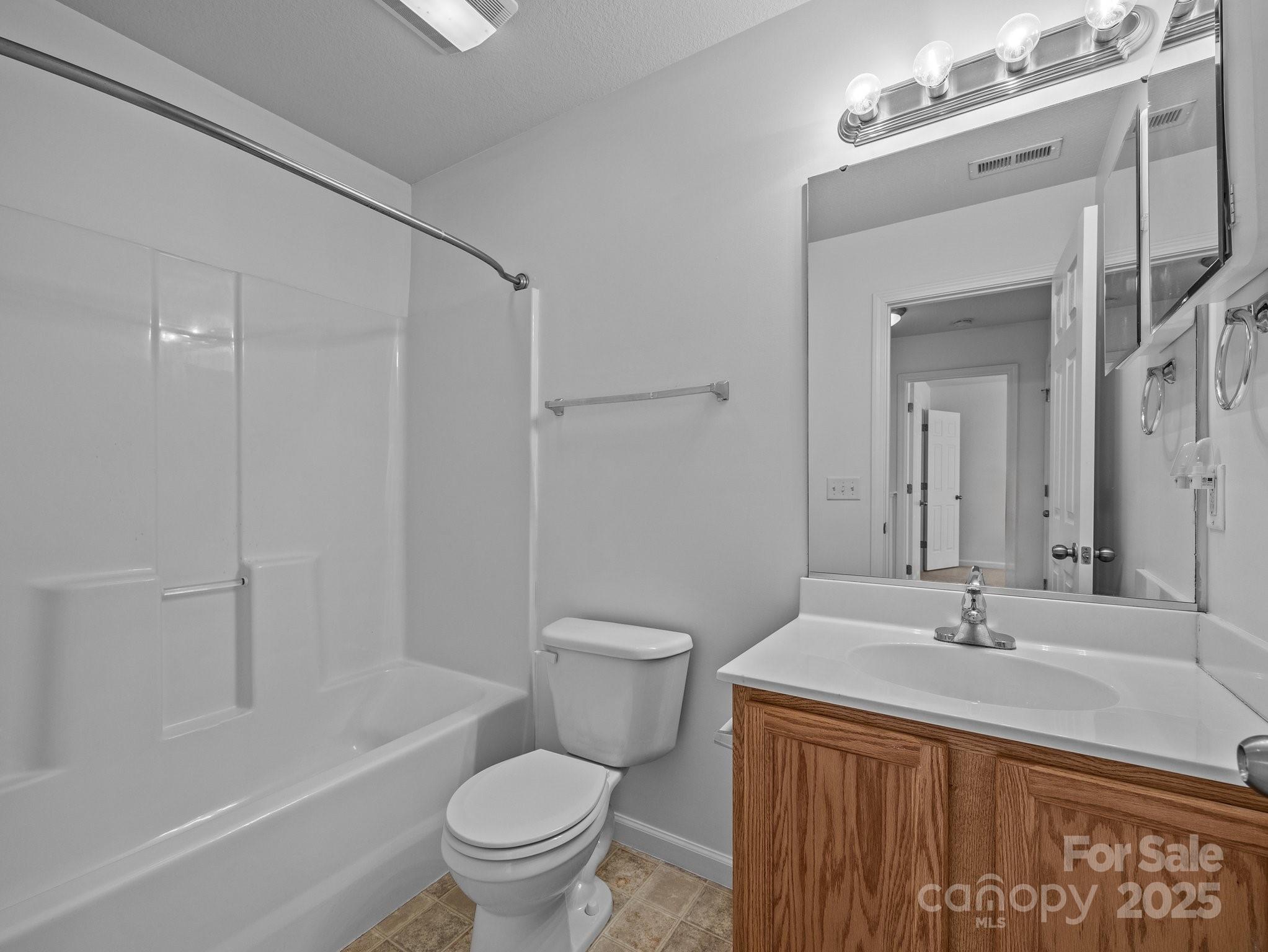 107 Alpine Ridge Drive Asheville, NC 28803 - Photo 23 of 29 a bathroom with a sink toilet and shower