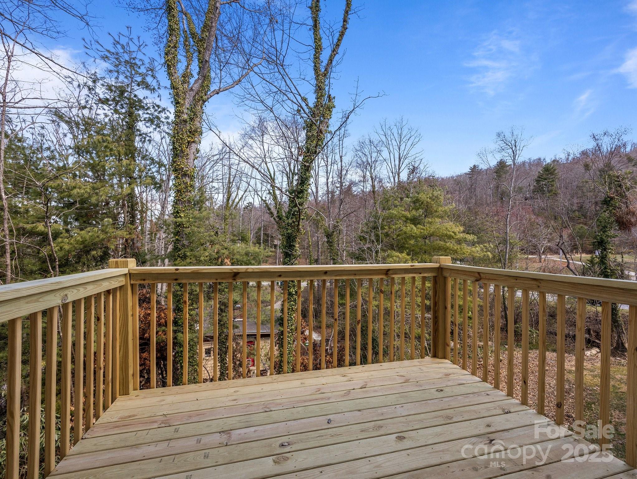 107 Alpine Ridge Drive Asheville, NC 28803 - Photo 24 of 29 a balcony with wooden floor and fence