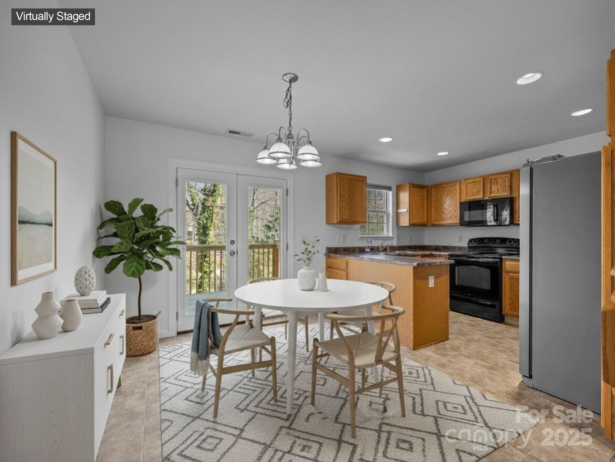 107 Alpine Ridge Drive Asheville, NC 28803 - Photo 6 of 29 a view of a dining room with furniture and chandelier