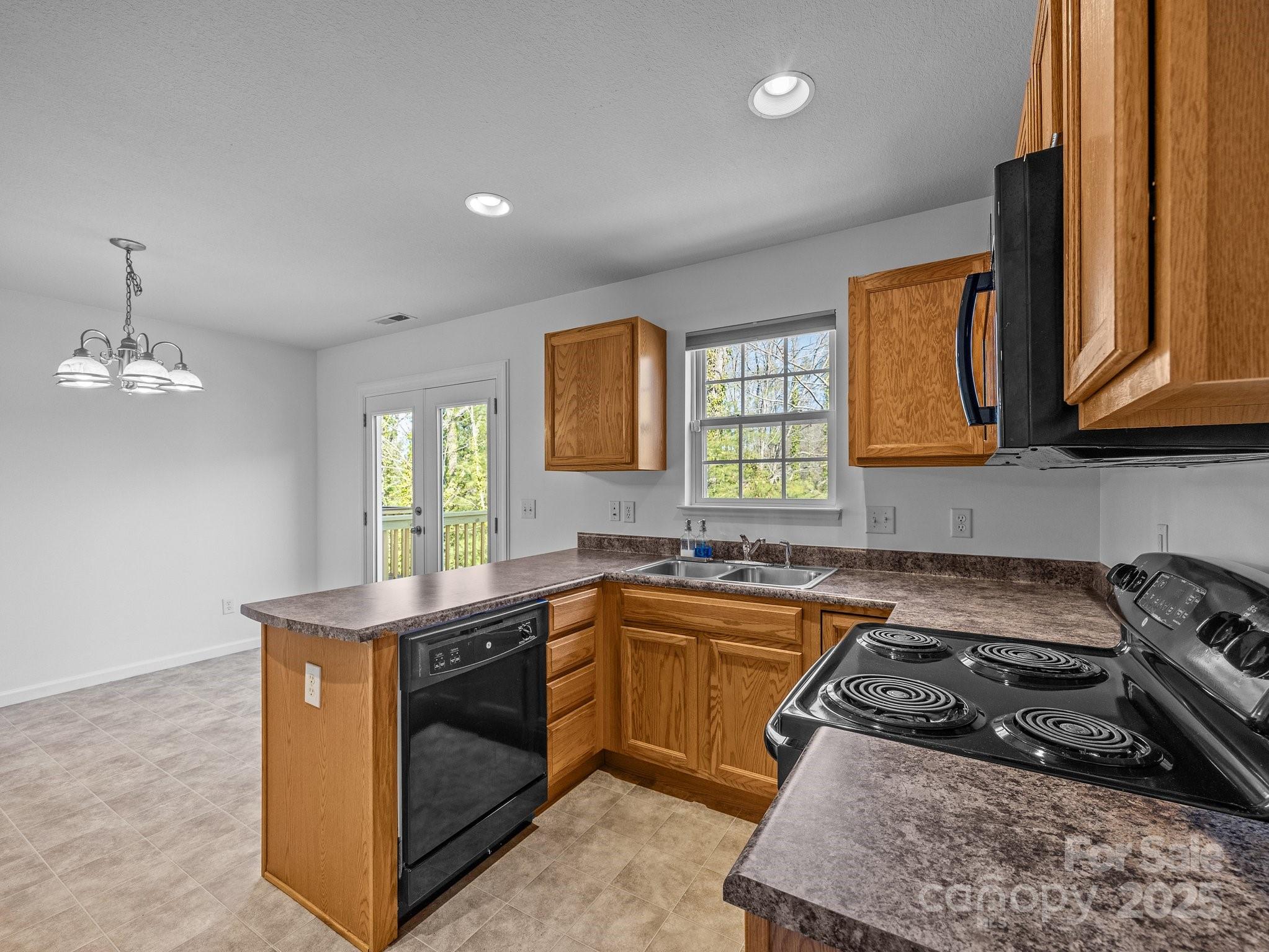 107 Alpine Ridge Drive Asheville, NC 28803 - Photo 9 of 29 a kitchen with a sink stove and cabinets