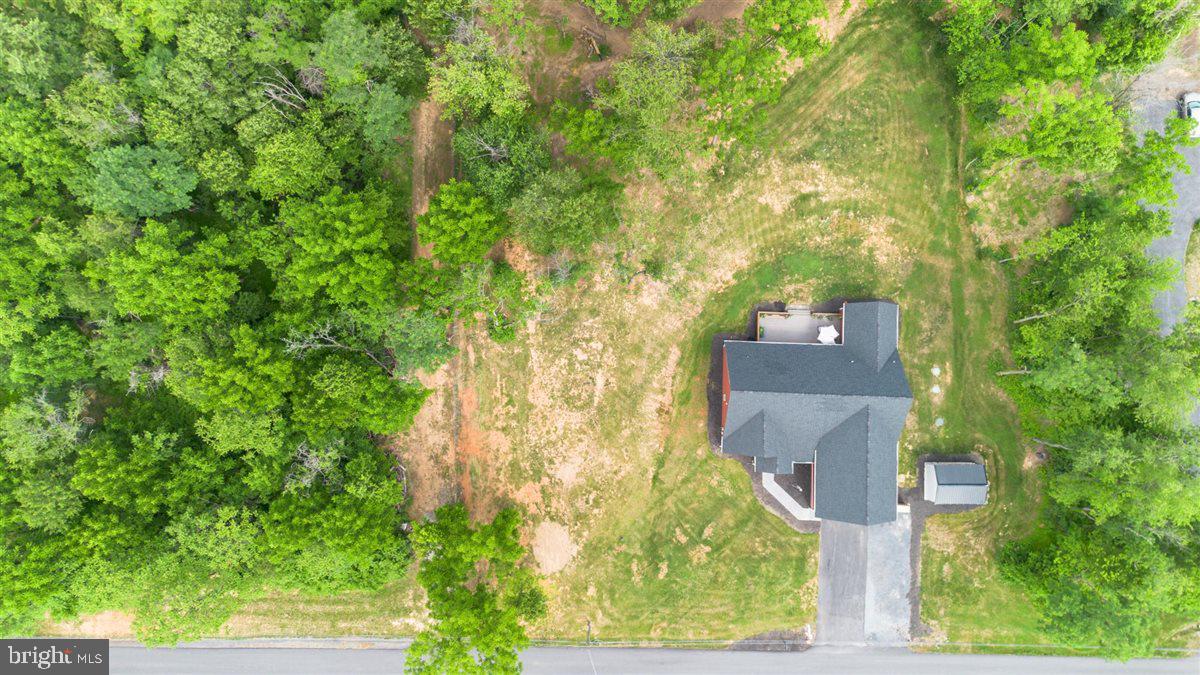 2390 Shirley Road Charles Town, WV 25414 - Photo 67 of 69 an aerial view of residential house with outdoor space and trees all around