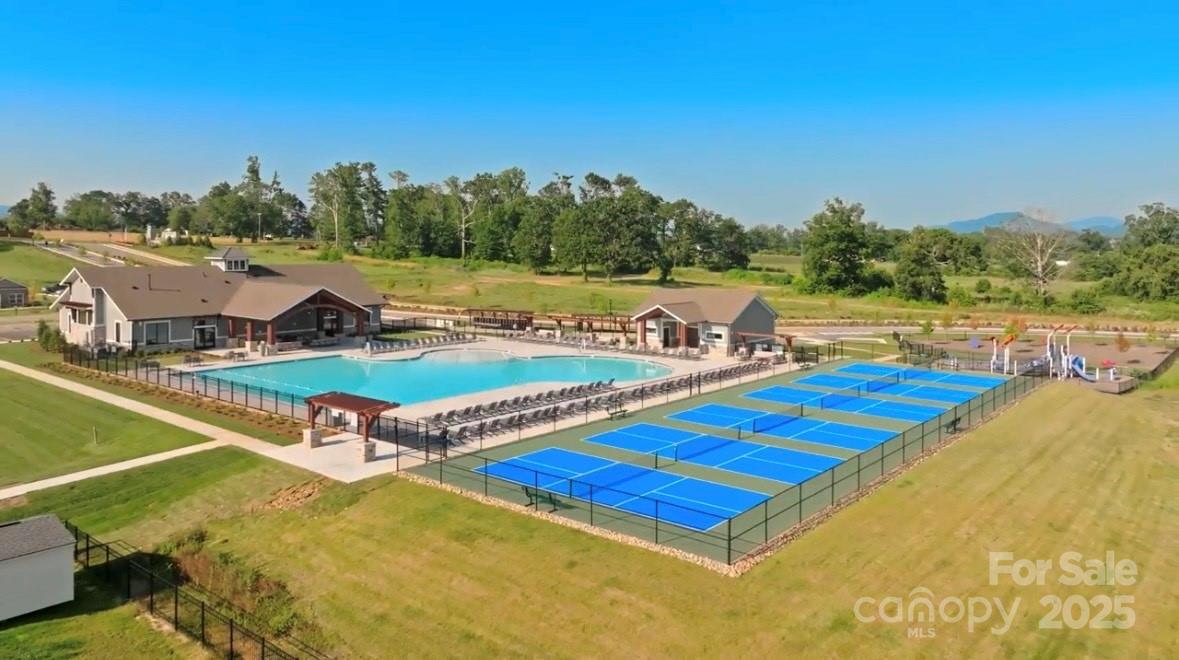 220 Salers Road Fletcher, NC 28732 - Photo 3 of 25 a view of a tennis ground with large trees