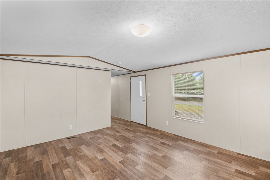 1188 Old Liberty Road Easley, SC 29640 - Photo 7 of 28 This bright living area features resilient vinyl plank flooring and ample natural light.