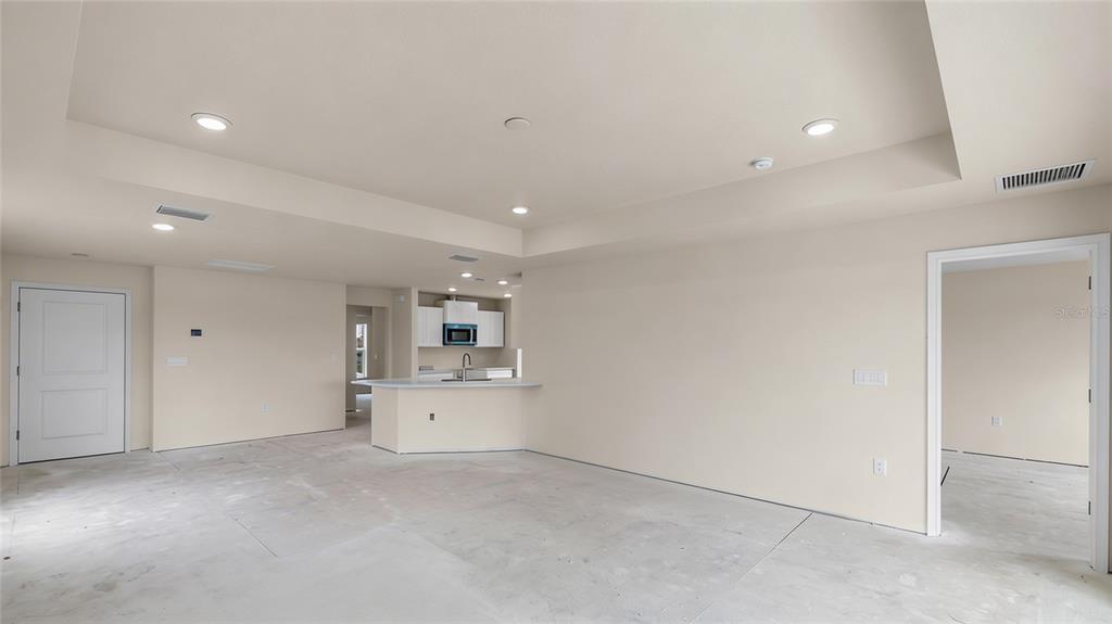 3498 Centavo Court Hernando Beach, FL 34607 - Photo 13 of 44 a view of empty room with a kitchen