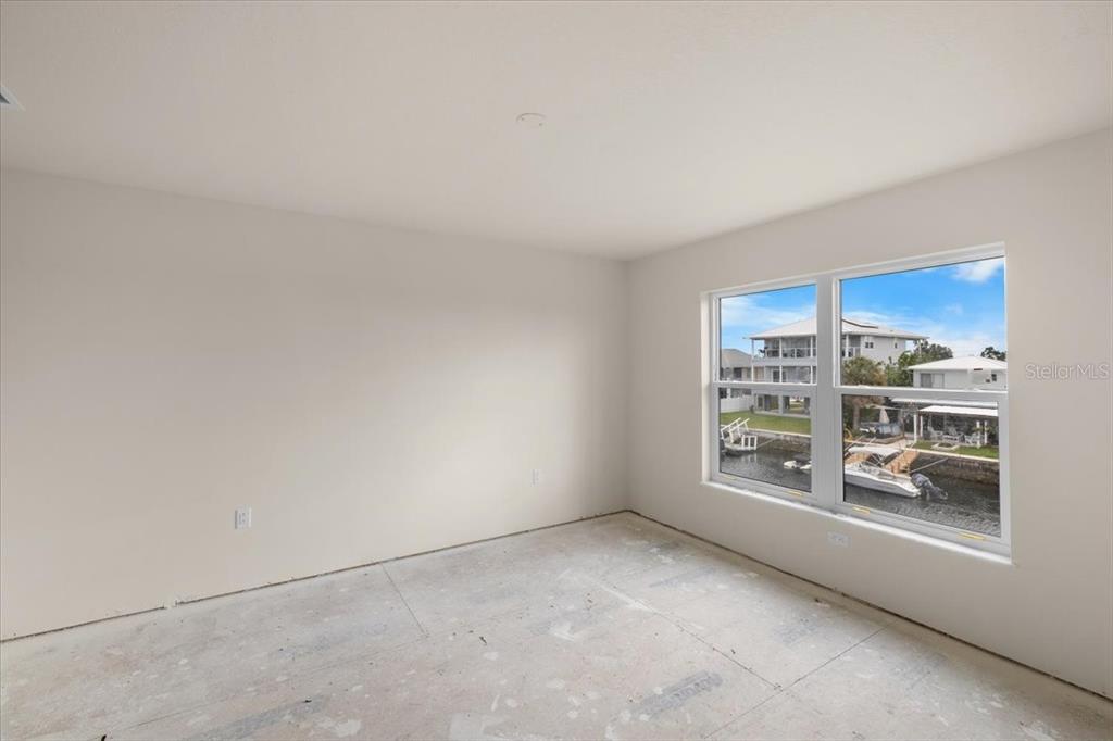 3498 Centavo Court Hernando Beach, FL 34607 - Photo 15 of 44 a view of an empty room with a window