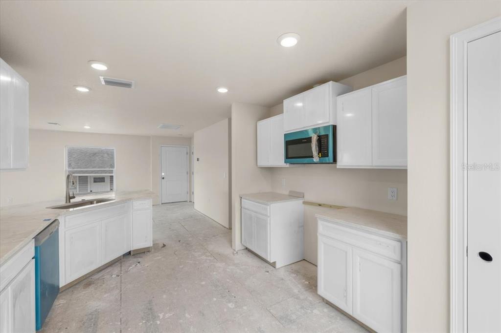 3498 Centavo Court Hernando Beach, FL 34607 - Photo 19 of 44 a view of a kitchen with electric appliances