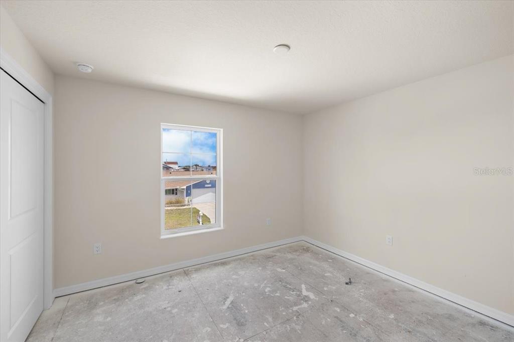 3498 Centavo Court Hernando Beach, FL 34607 - Photo 27 of 44 an empty room with windows
