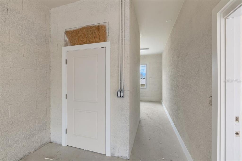 3498 Centavo Court Hernando Beach, FL 34607 - Photo 32 of 44 a view of a hallway with wooden floor