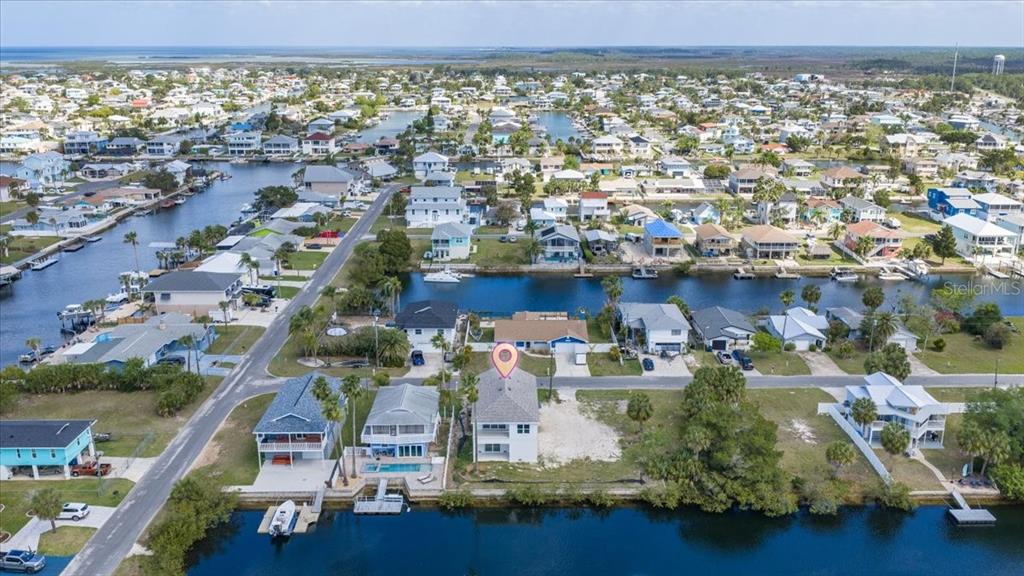 3498 Centavo Court Hernando Beach, FL 34607 - Photo 39 of 44 an aerial view of residential houses with outdoor space