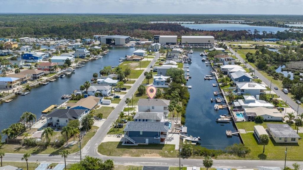 3498 Centavo Court Hernando Beach, FL 34607 - Photo 42 of 44 an aerial view of residential houses with outdoor space