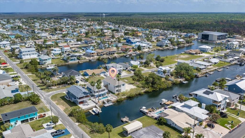 3498 Centavo Court Hernando Beach, FL 34607 - Photo 43 of 44 an aerial view of residential houses with outdoor space