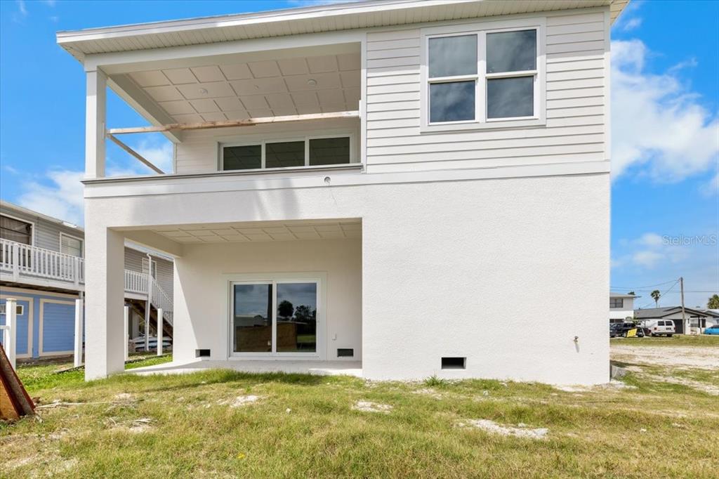 3498 Centavo Court Hernando Beach, FL 34607 - Photo 10 of 44 a large building with a large windows