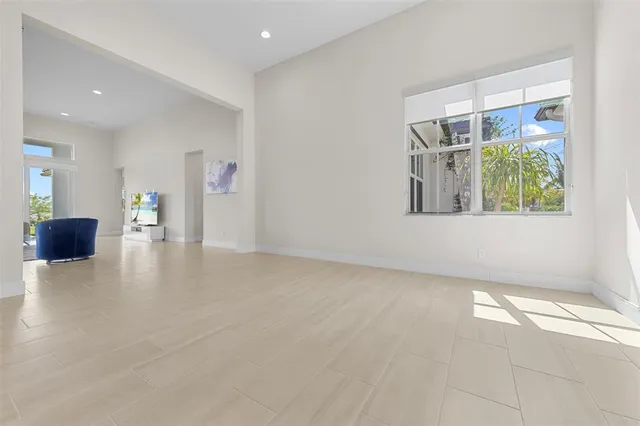 a spacious bedroom with a bed and couch