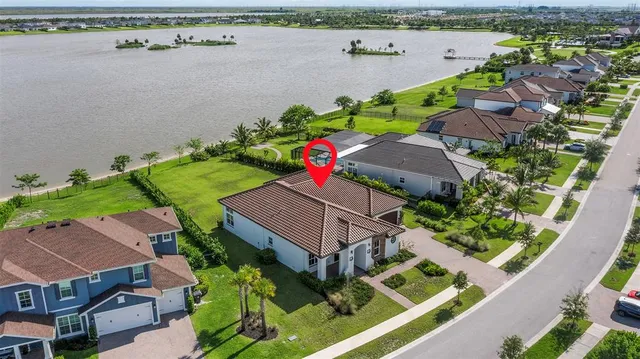 an aerial view of lake and city