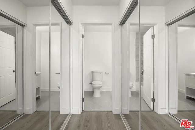 a bathroom with a shower and a toilet