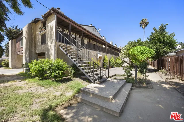a view of a building with a yard