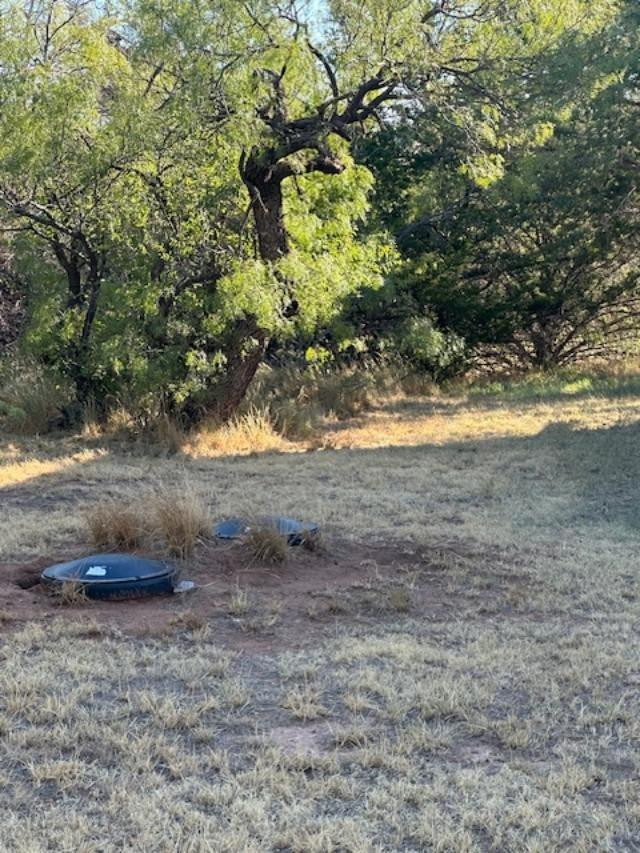 9 Mesquite Loop Roaring Springs, TX 79256 - Photo 17 of 22 a backyard of a house
