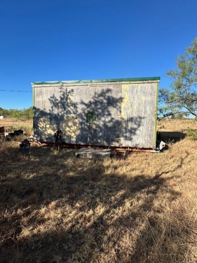 9 Mesquite Loop Roaring Springs, TX 79256 - Photo 18 of 22 a view of a yard with wooden fence