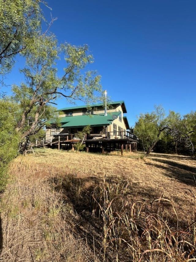 9 Mesquite Loop Roaring Springs, TX 79256 - Photo 2 of 22 a view of a backyard of the house