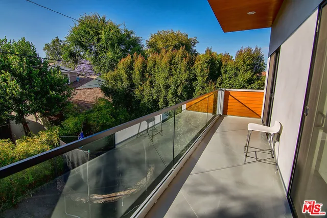 a view of balcony with a potted plant