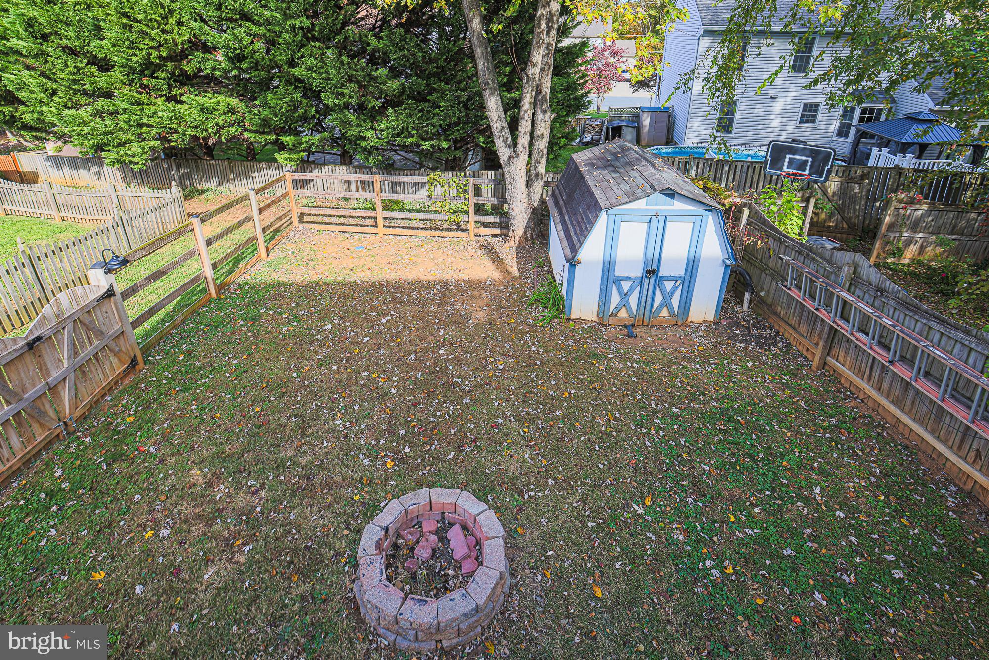 48 Stoneway Place Baltimore, MD 21236 - Photo 46 of 54 Fenced in Backyard and Shed from the Deck