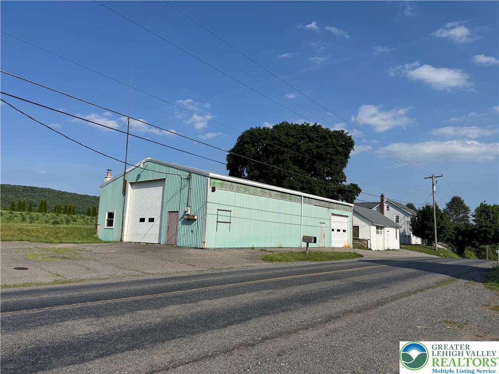 868 Catawissa Road Tamaqua, PA 18252 - Photo 17 of 67 A versatile commercial space awaits, featuring a substantial building with ample garage access.